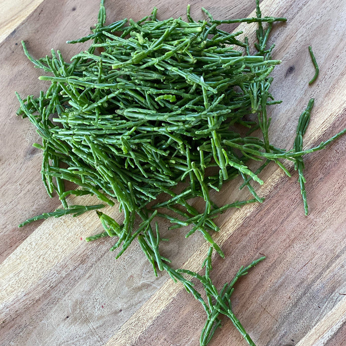 fresh green samphire on a wooden board