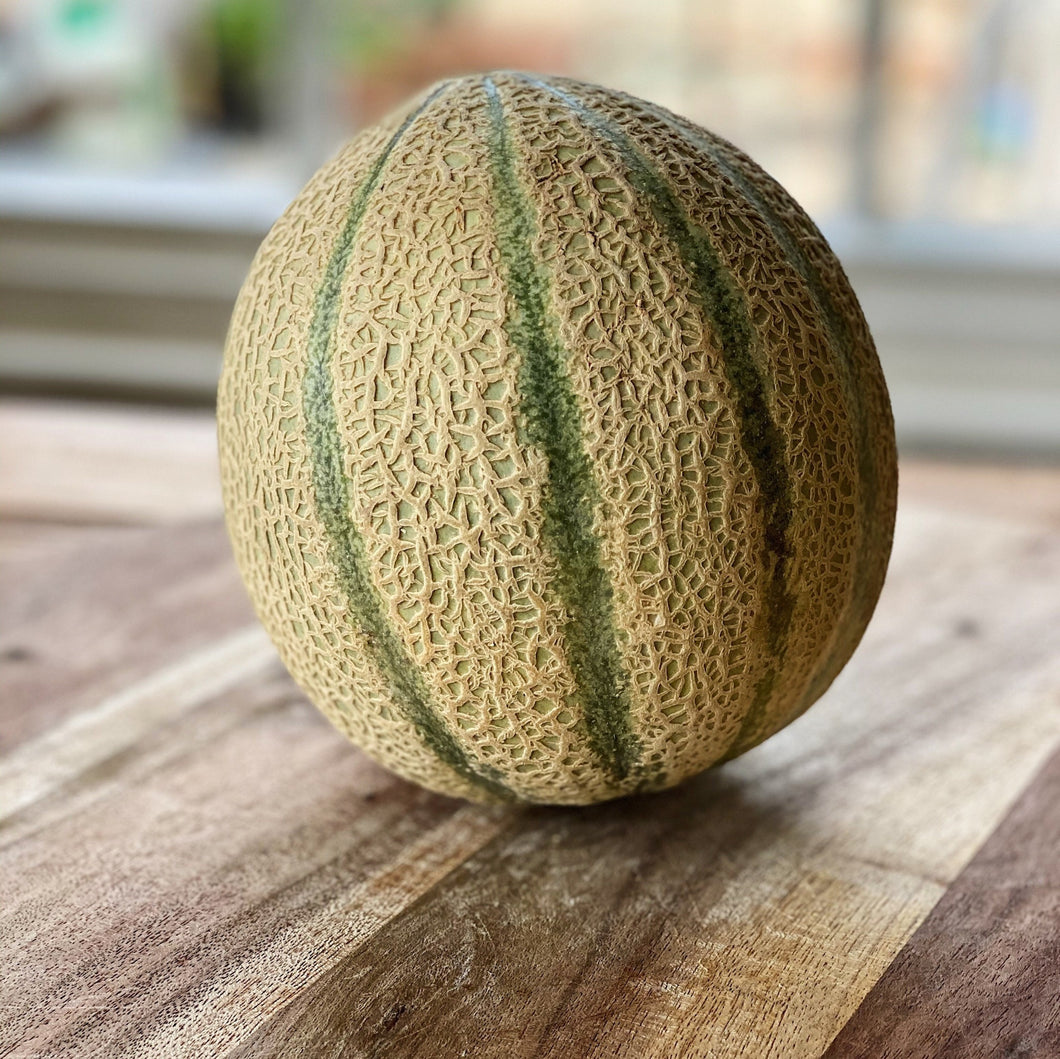 canteloupe melon on a wooden board