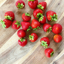 Load image into Gallery viewer, collection of fresh british strawberries on a wooden board
