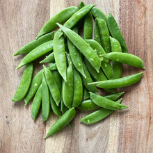 Load image into Gallery viewer, fresh sugarsnap peas on a wooden board
