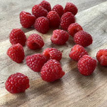 Load image into Gallery viewer, fresh raspberries on a wooden board
