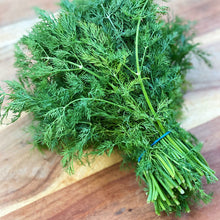 Load image into Gallery viewer, fresh bunch of dill on a wooden board
