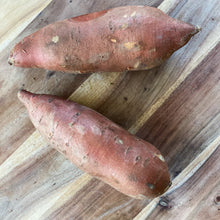 Load image into Gallery viewer, 2 sweet potatoes on a wooden board
