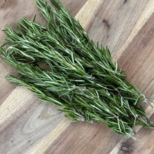 Load image into Gallery viewer, fresh bunch of rosemary on a wooden board
