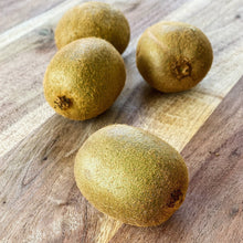 Load image into Gallery viewer, 4 kiwi fruits on a wooden board
