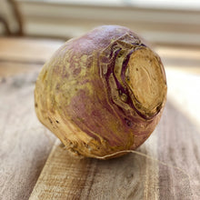 Load image into Gallery viewer, raw swede on a wooden board
