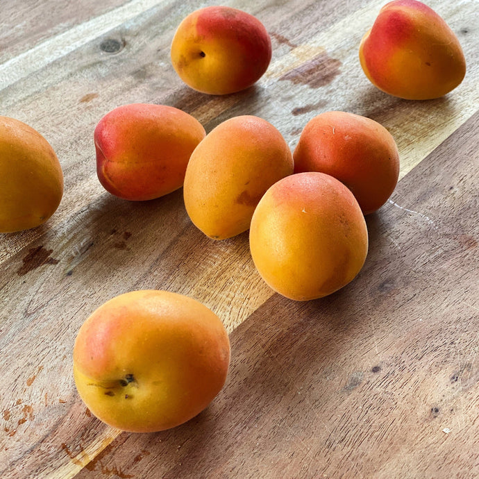 apricots on a wooden board