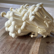 Load image into Gallery viewer, white beech mushrooms on a wooden board
