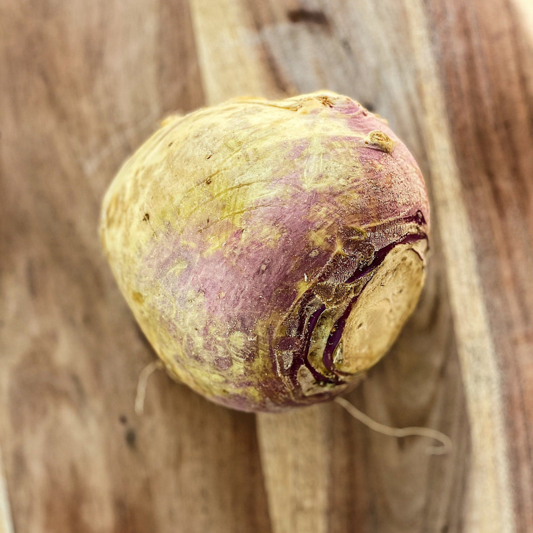 raw swede on a wooden board