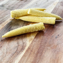 Load image into Gallery viewer, baby corn on a wooden board
