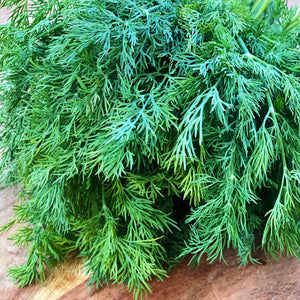 fresh dill on a wooden board