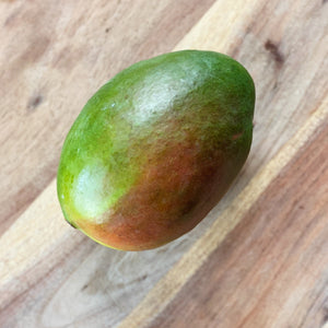 fresh mango on a wooden board