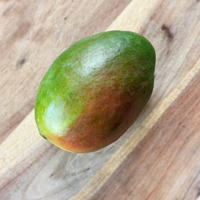 fresh mango on a wooden board