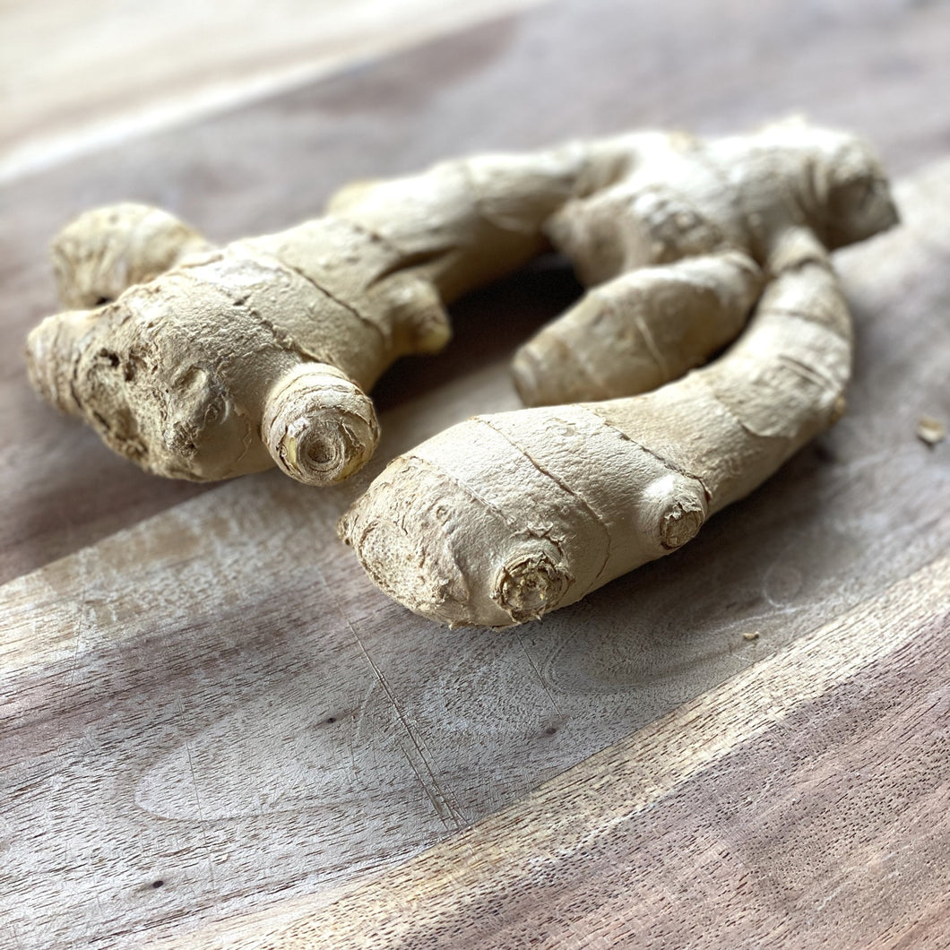 stem of ginger root on a wooden board