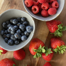 Load image into Gallery viewer, blueberries and rasberries in bowls and loose strawberries on a wooden board
