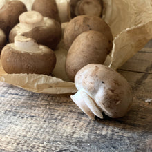 Load image into Gallery viewer, Chestnut Mushrooms spilling out of a paper bag
