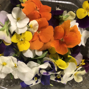 edible viola flowers in a punnet